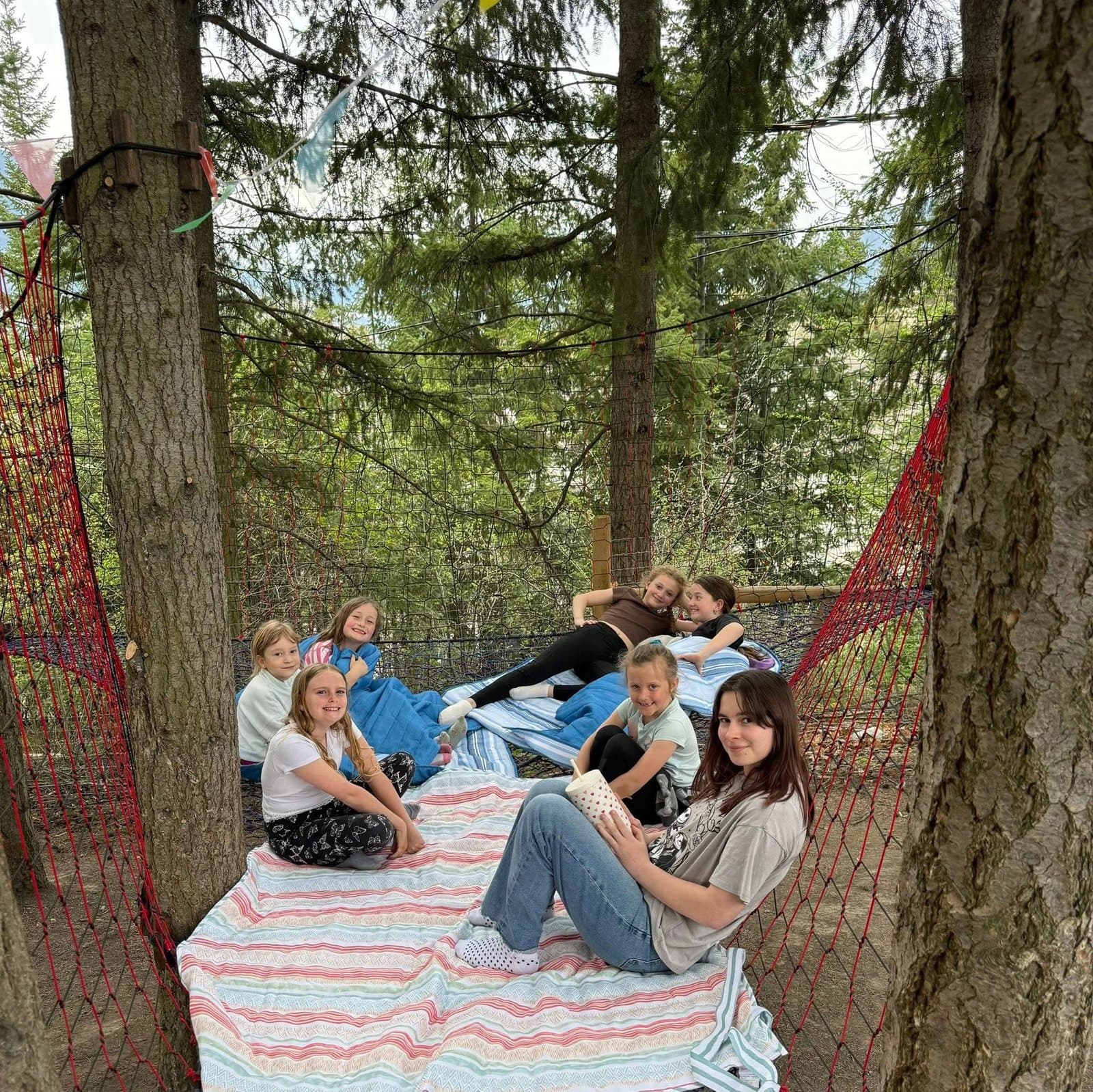Children spending time together in the woods at Shuswap Kids Club