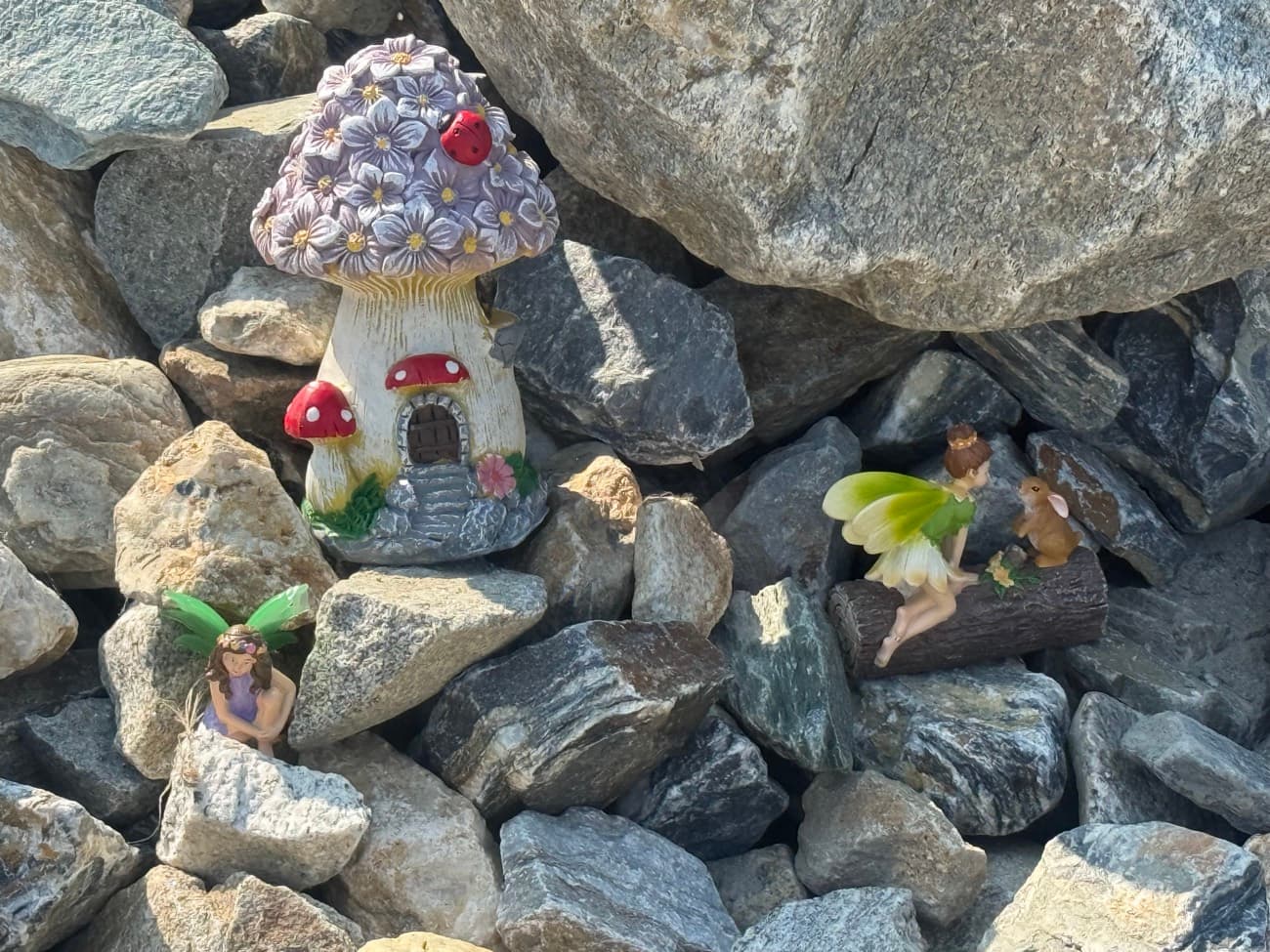 A fairy house and woodland friends tucked among the trees and rocks at Shuswap Kids Club