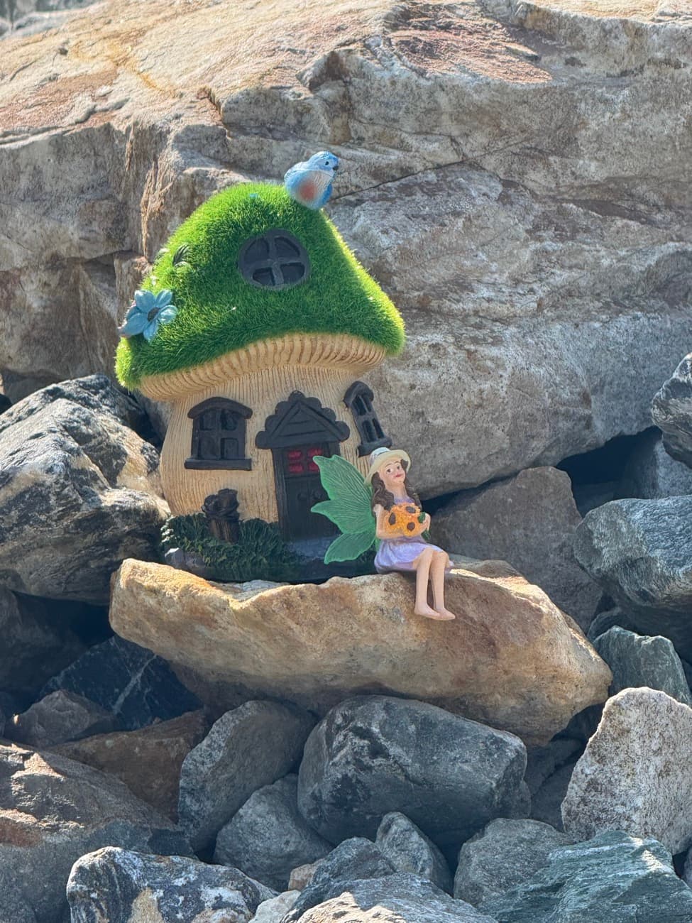 A fairy house and woodland friends tucked among the trees and rocks at Shuswap Kids Club