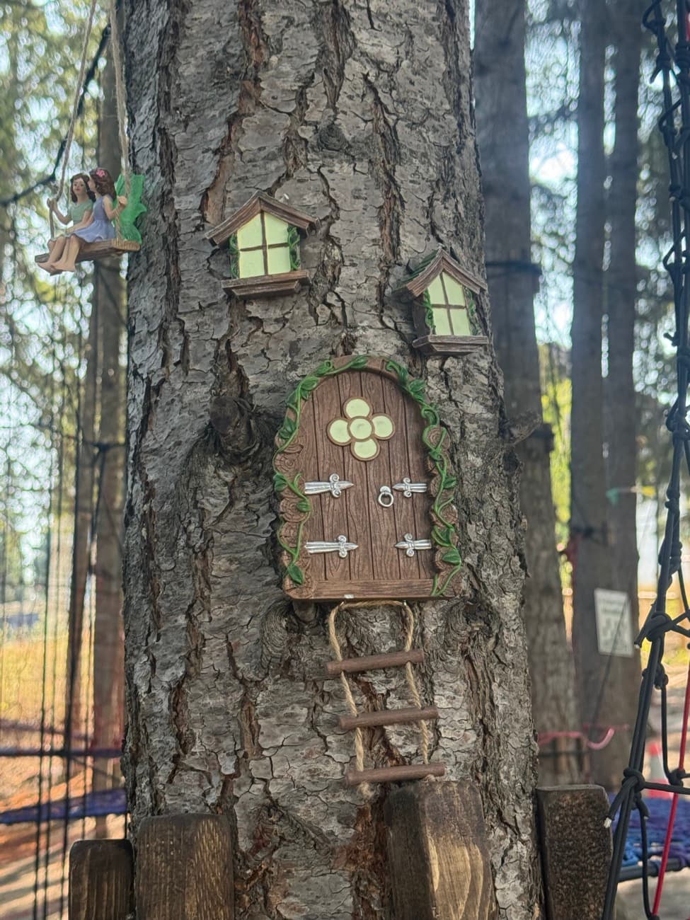 A fairy house and woodland friends tucked among the trees and rocks at Shuswap Kids Club