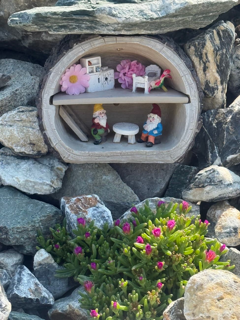 A fairy house and woodland friends tucked among the trees and rocks at Shuswap Kids Club