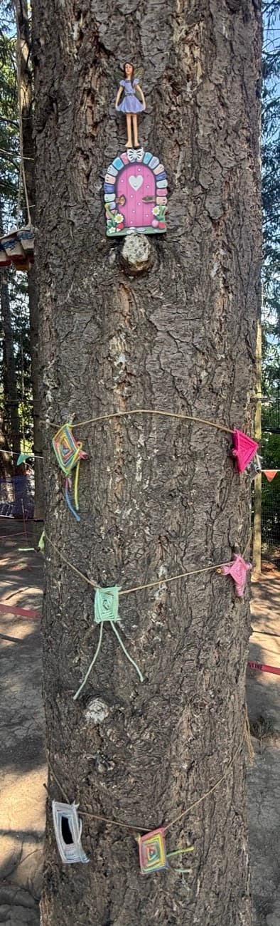 A fairy house and woodland friends tucked among the trees and rocks at Shuswap Kids Club